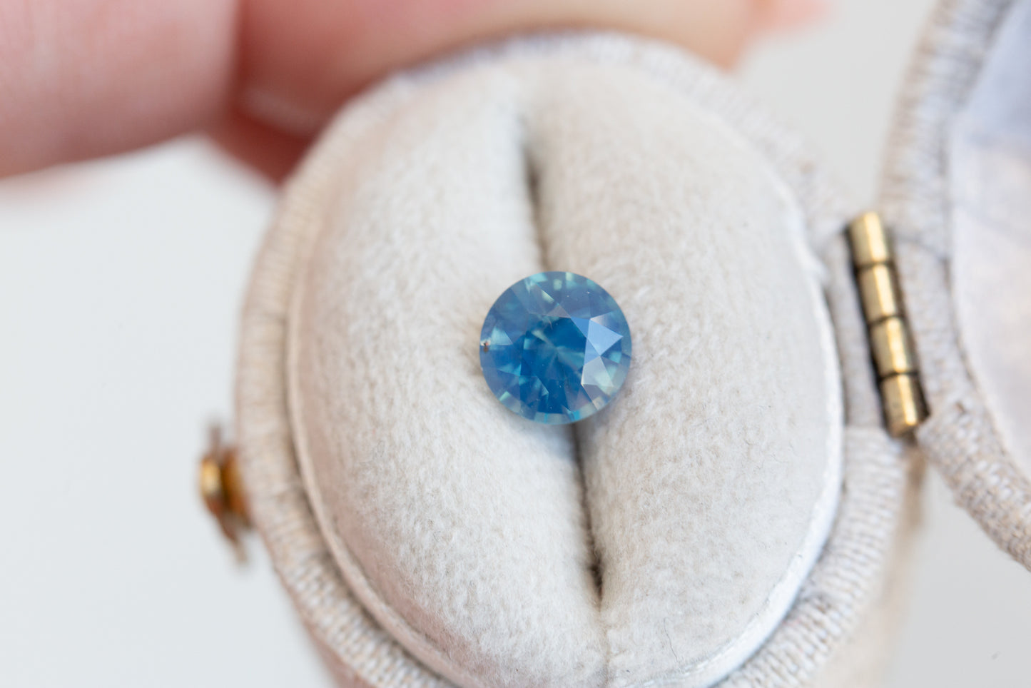 Load image into Gallery viewer, 1.3ct round opalescent blue sapphire
