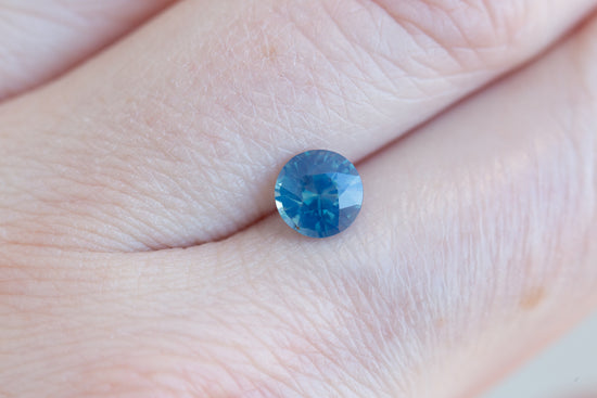 Load image into Gallery viewer, 1.3ct round opalescent blue sapphire
