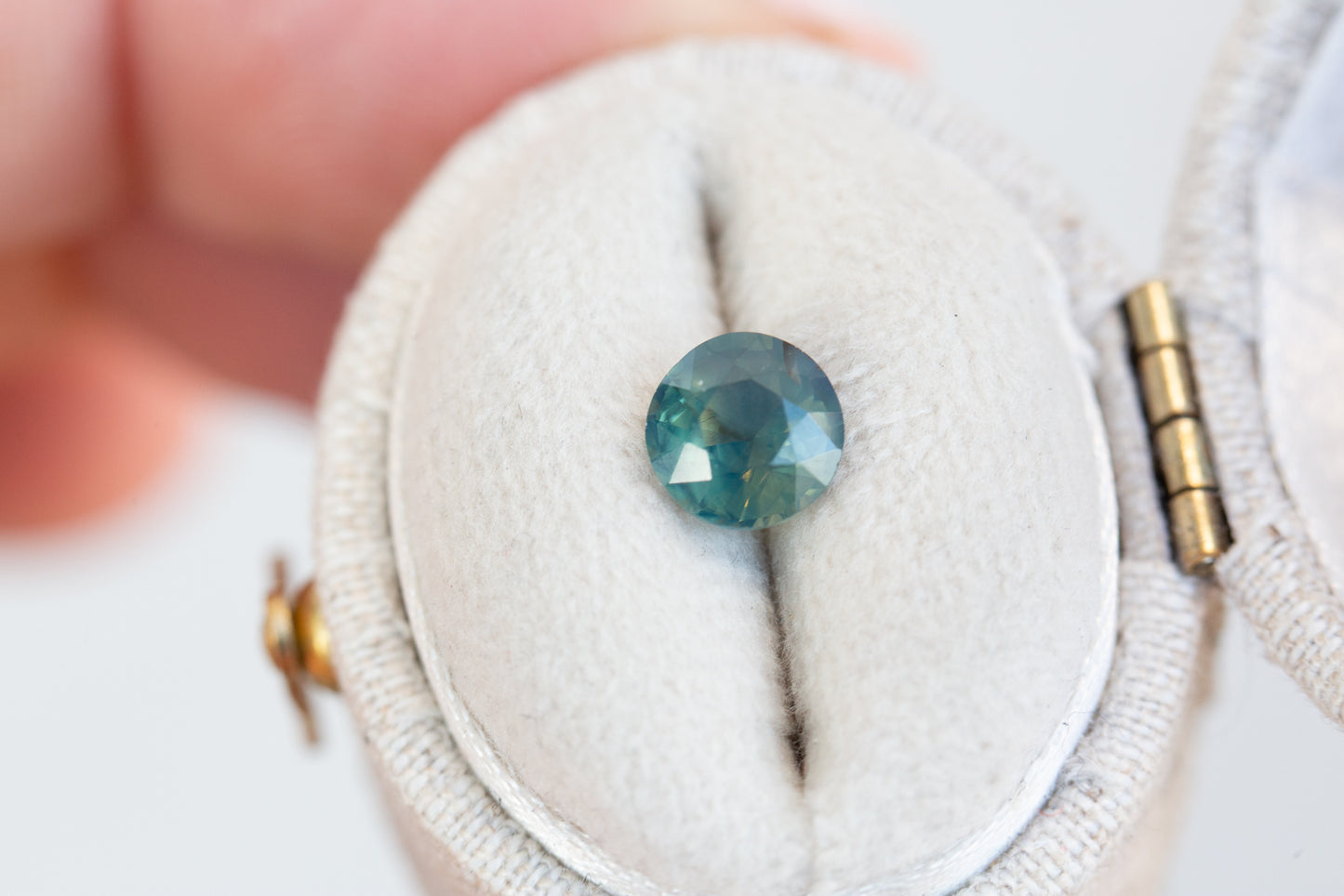 1.26ct round opalescent teal sapphire