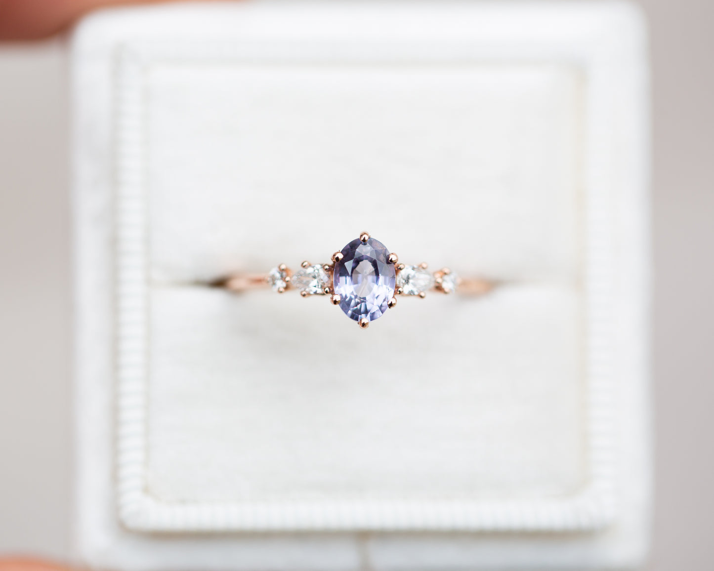 Five stone ring with oval lavender sapphire