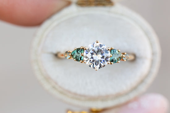 Load image into Gallery viewer, Five stone round moissanite and teal sapphire ring
