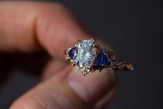 Briar rose three stone with 8x6mm oval moissanite and tanzanite
