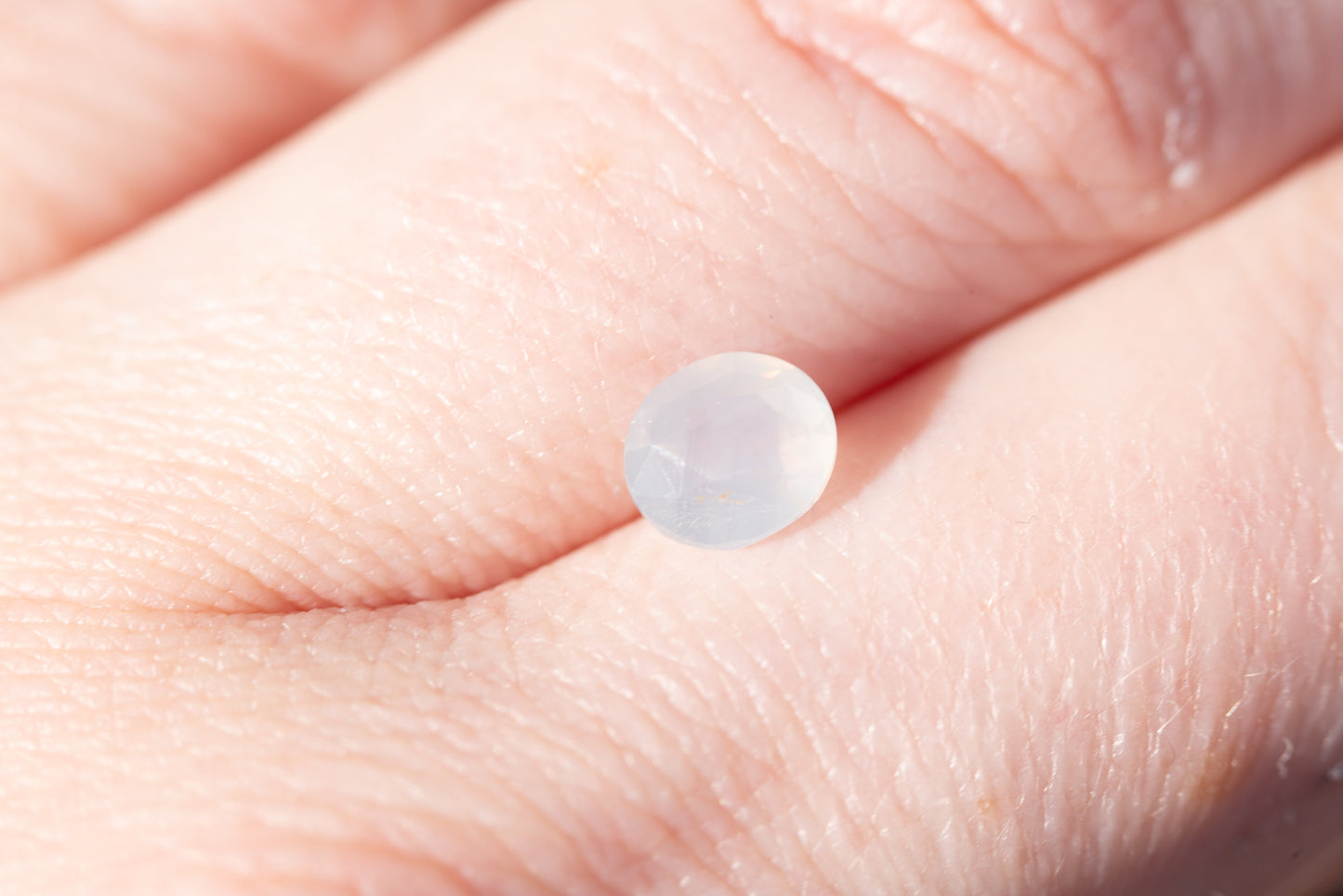 1.25ct oval opalescent white/opaque white