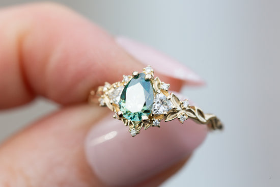 Briar rose three stone with pear teal moissanite