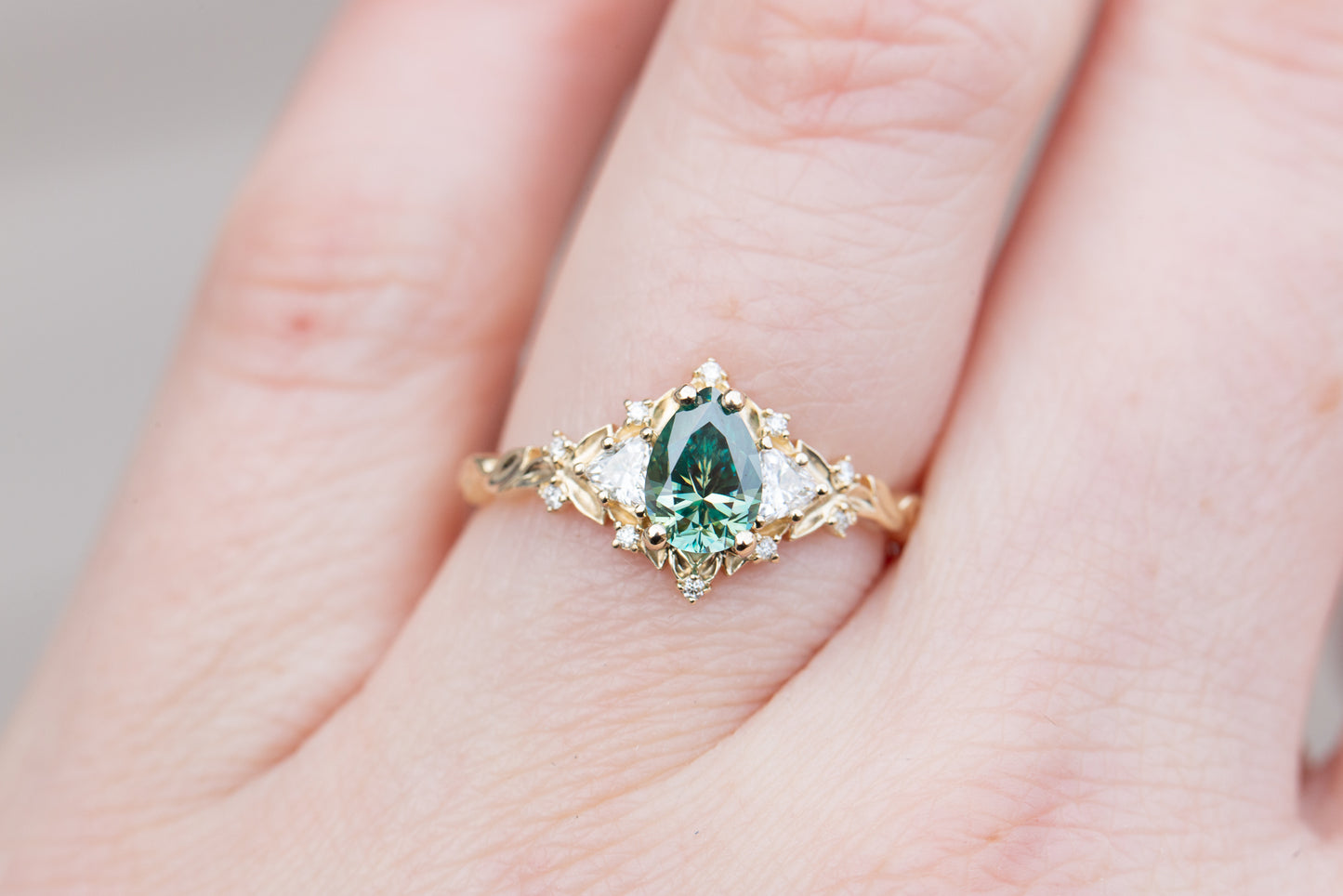 Briar rose three stone with pear teal moissanite