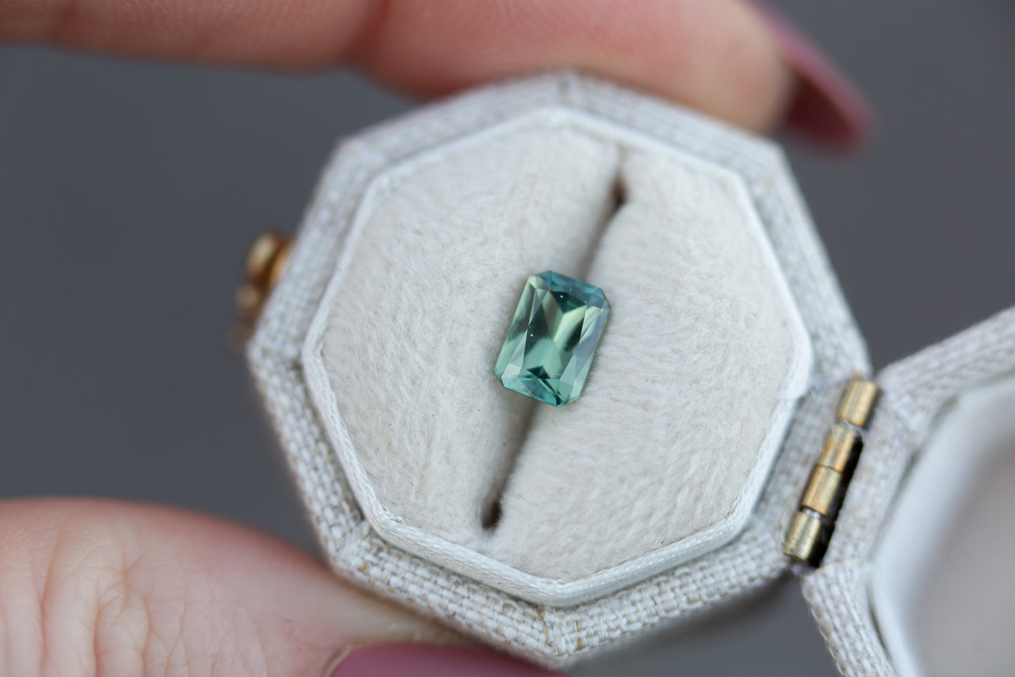 ON HOLD .99ct emerald cut green/teal sapphire