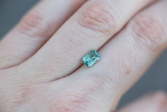 ON HOLD .99ct emerald cut green/teal sapphire