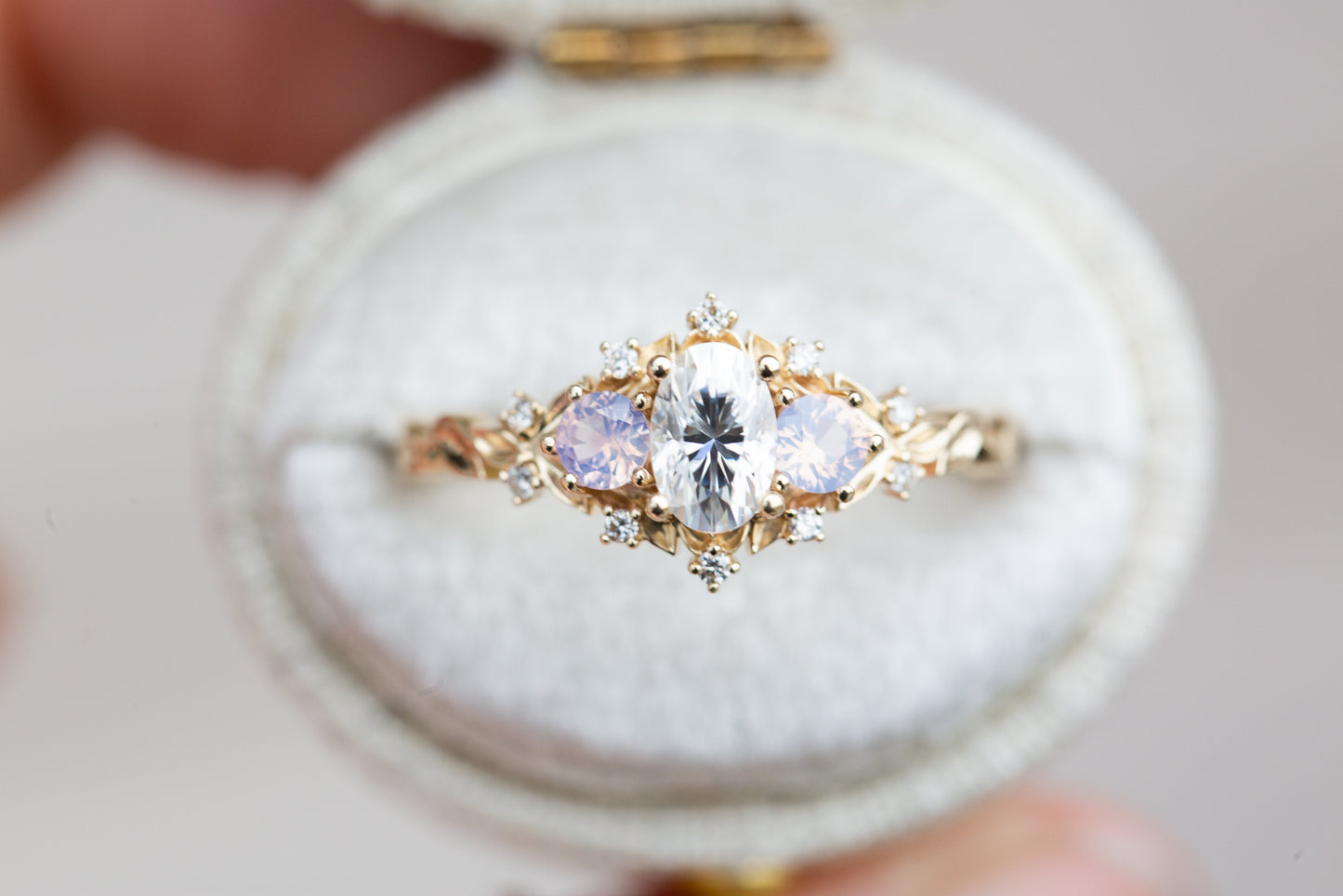 Load image into Gallery viewer, Briar rose three stone with oval moissanite and opalescent sapphires
