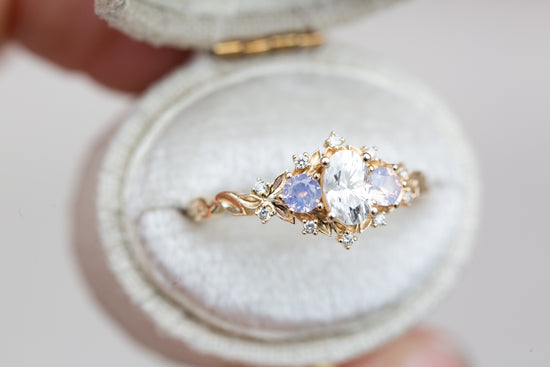 Load image into Gallery viewer, Briar rose three stone with oval moissanite and opalescent sapphires
