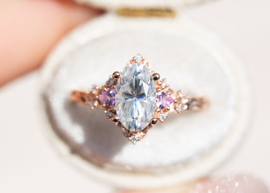 Briar rose three stone with elongated oval moissanite and pink sapphire