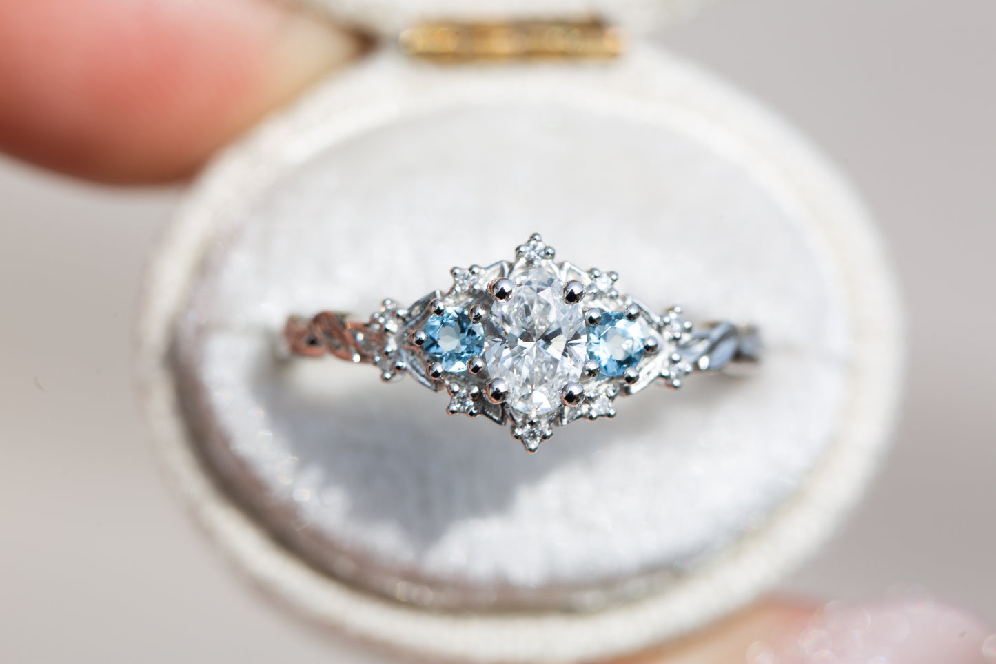 Load image into Gallery viewer, Briar rose three stone with 6x4mm oval center and aquamarine side stones
