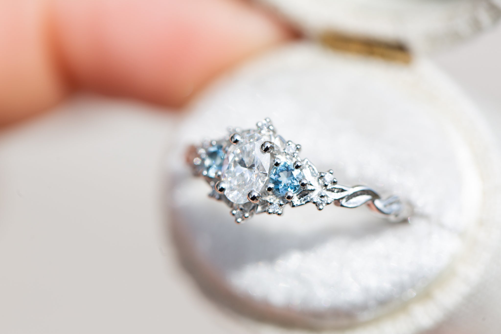 Briar rose three stone with 6x4mm oval center and aquamarine side