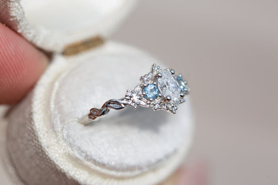 Load image into Gallery viewer, Briar rose three stone with 6x4mm oval center and aquamarine side stones
