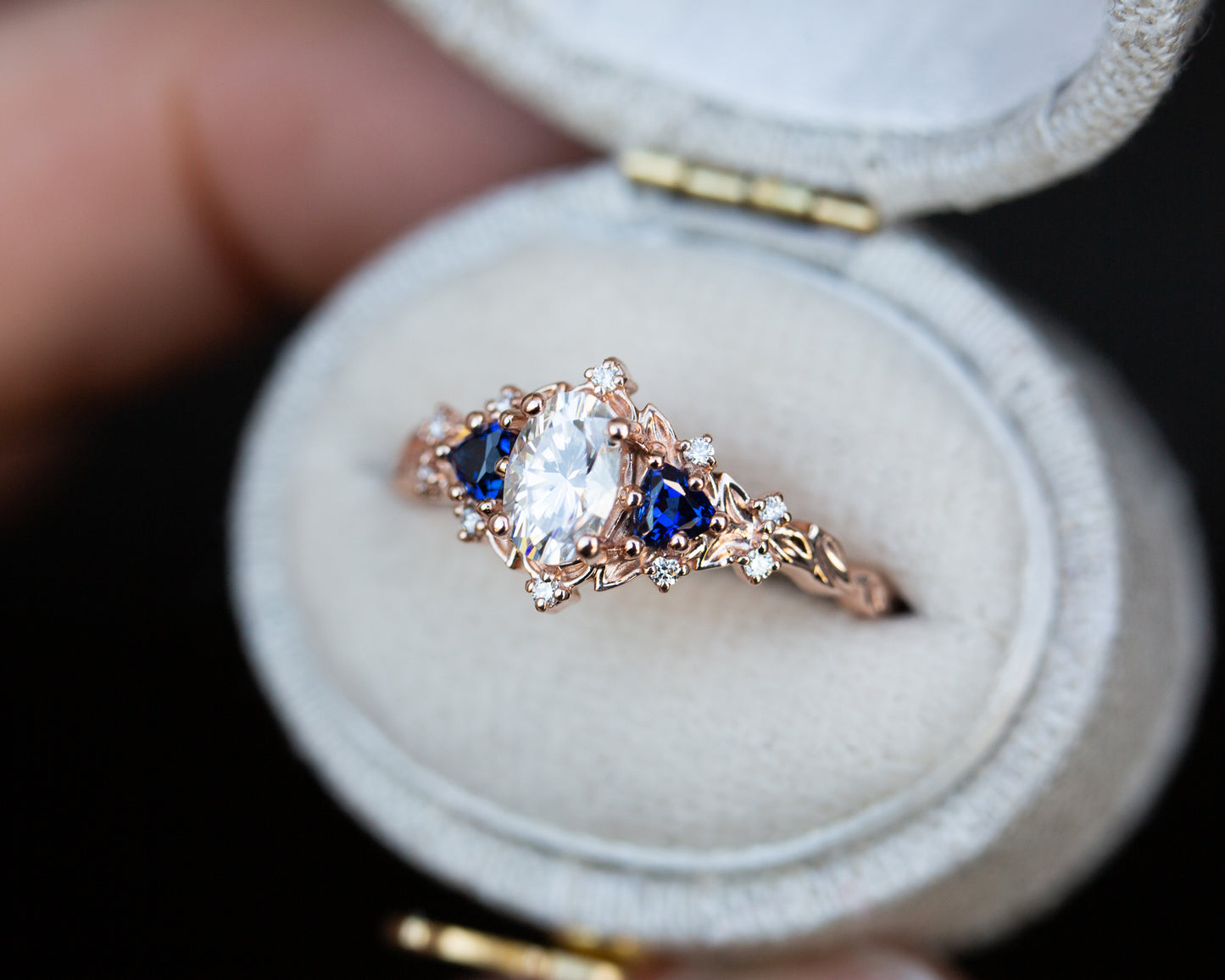 Briar rose three stone with oval moissanite and blue sapphire