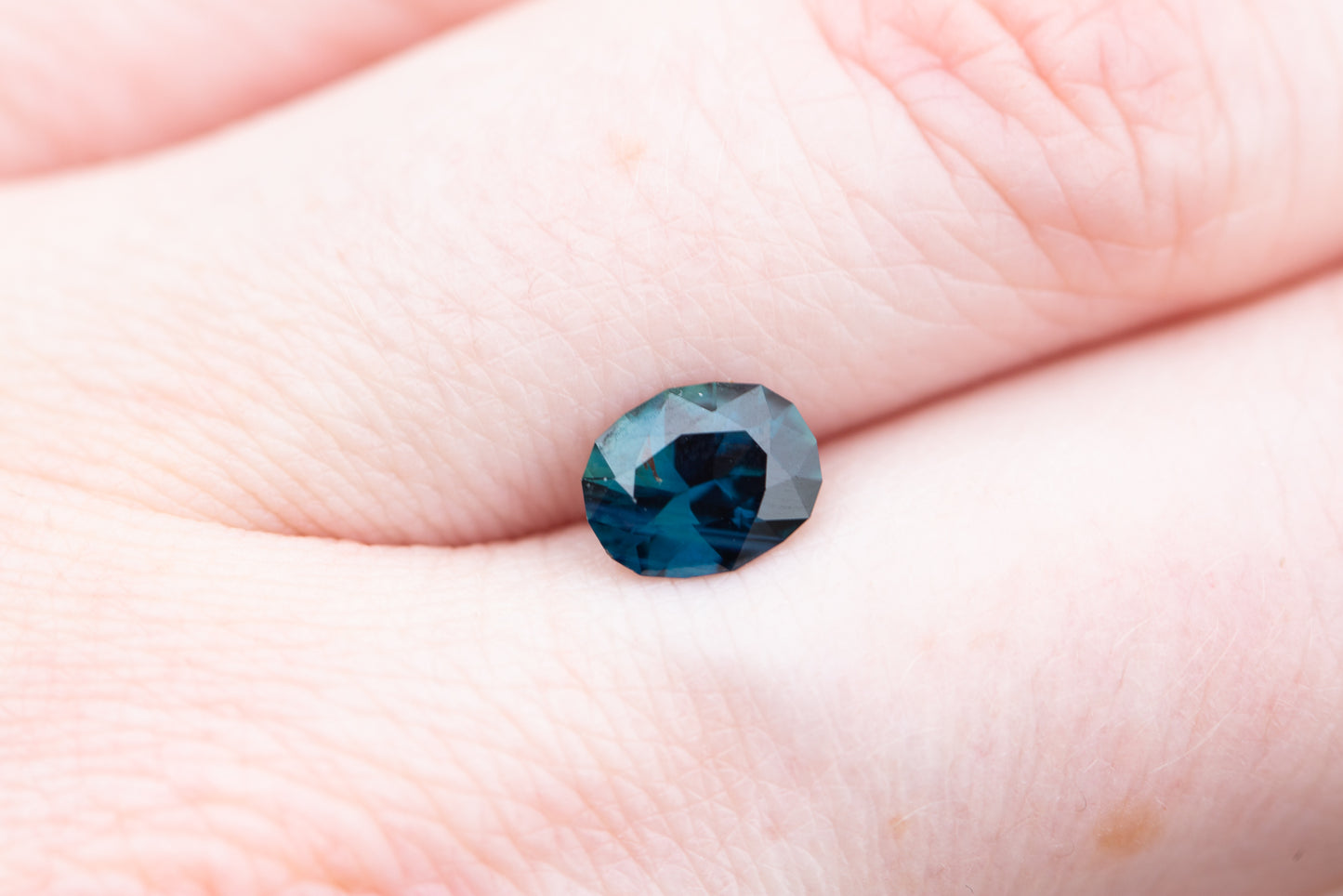 Load image into Gallery viewer, ON HOLD 1.34ct oval precision cut dark blue teal sapphire
