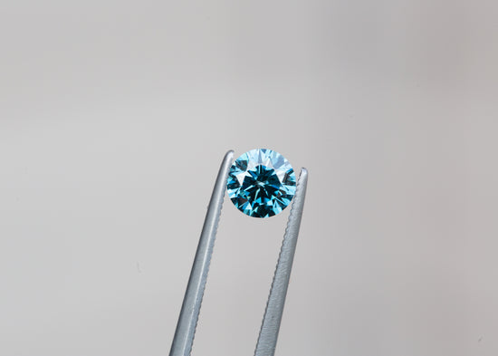 Load image into Gallery viewer, .64ct round fancy vivid blue lab diamond
