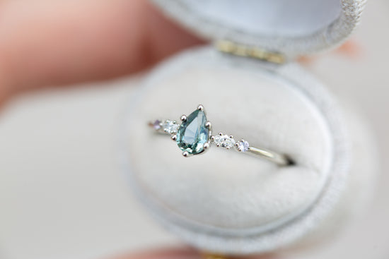 Pear teal Montana sapphire five stone ring with diamonds and lavender sapphire