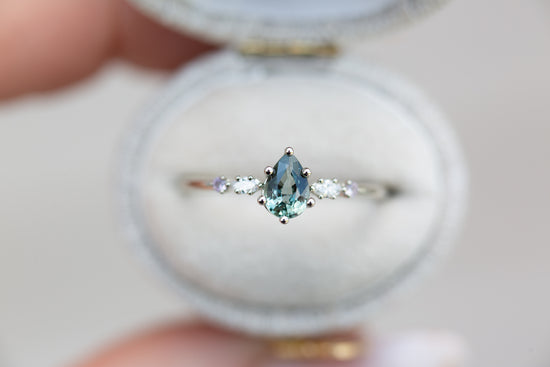 Pear teal Montana sapphire five stone ring with diamonds and lavender sapphire