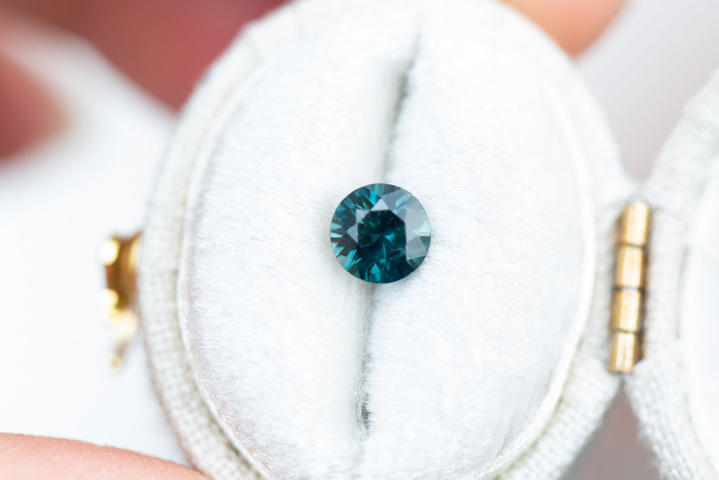 .87ct round blue green sapphire