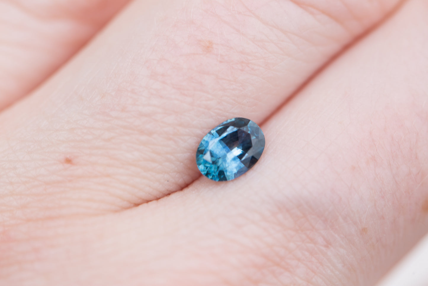 .84ct oval blue teal sapphire