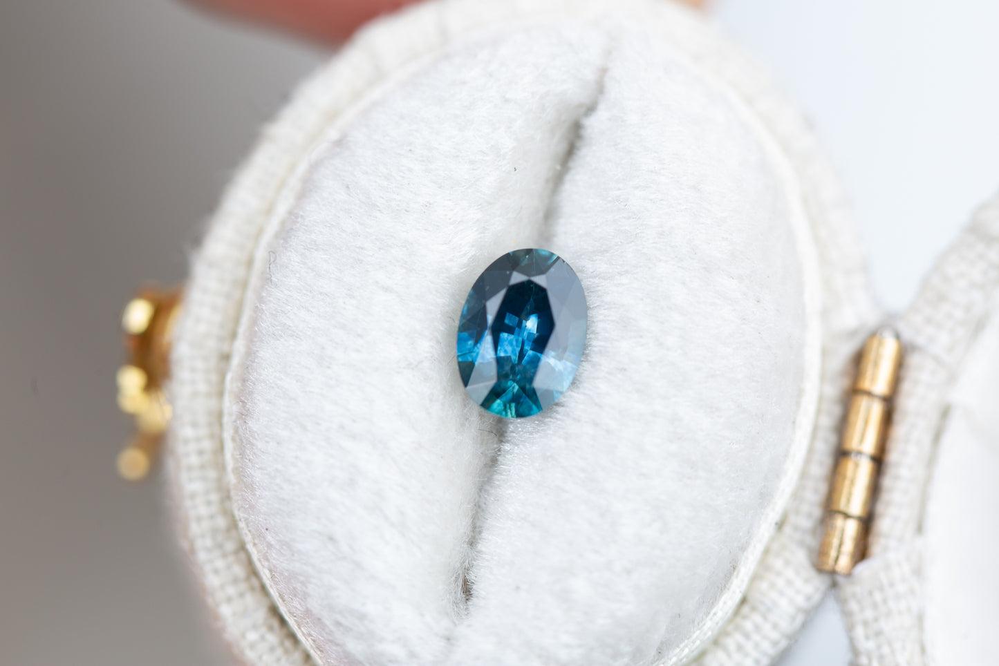 .84ct oval darker blue with hint of teal sapphire