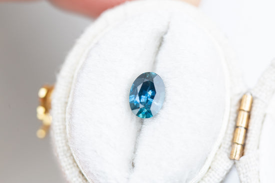 .84ct oval darker blue with hint of teal sapphire