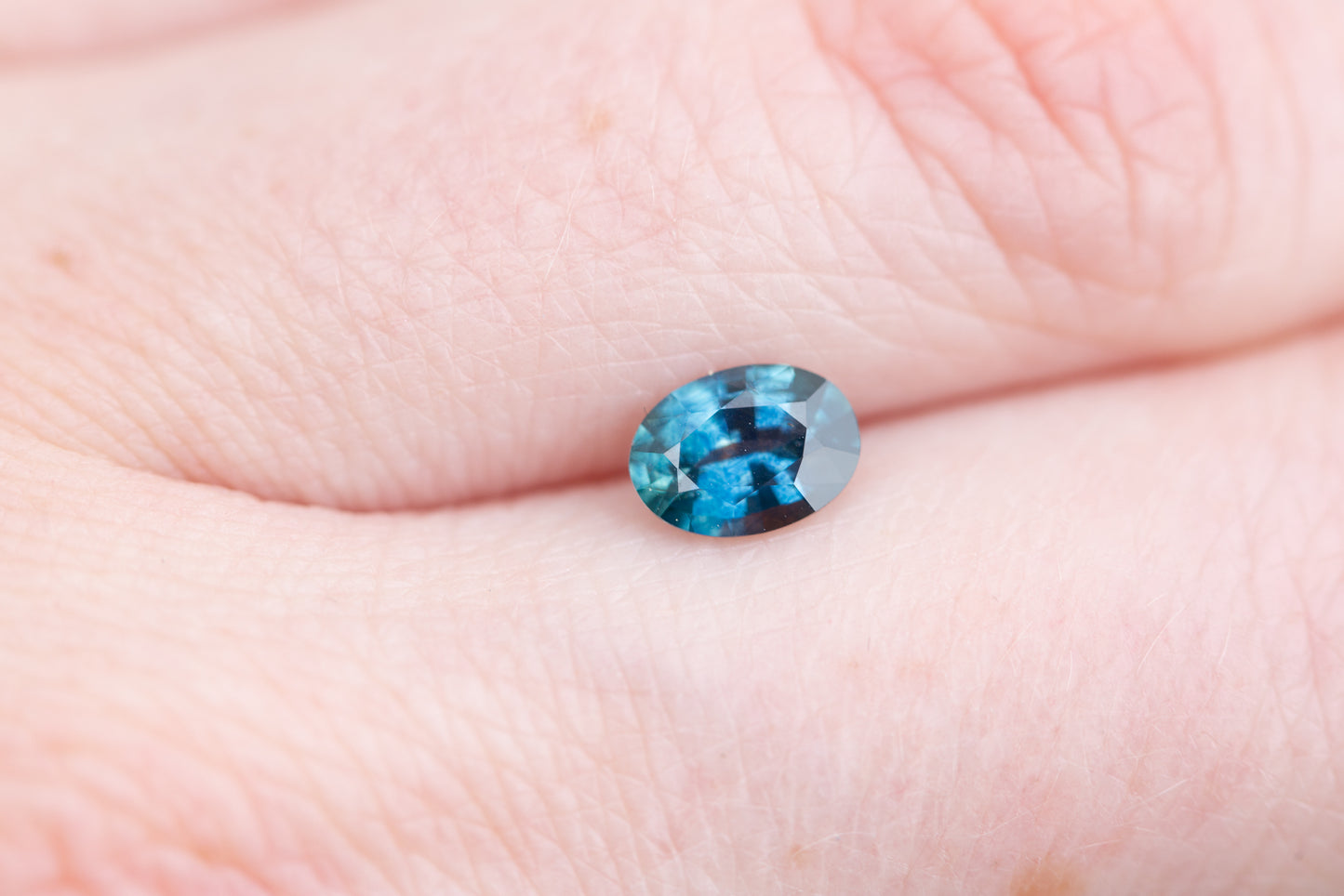 .84ct oval darker blue with hint of teal sapphire