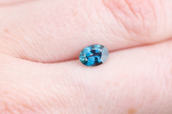 .84ct oval darker blue with hint of teal sapphire