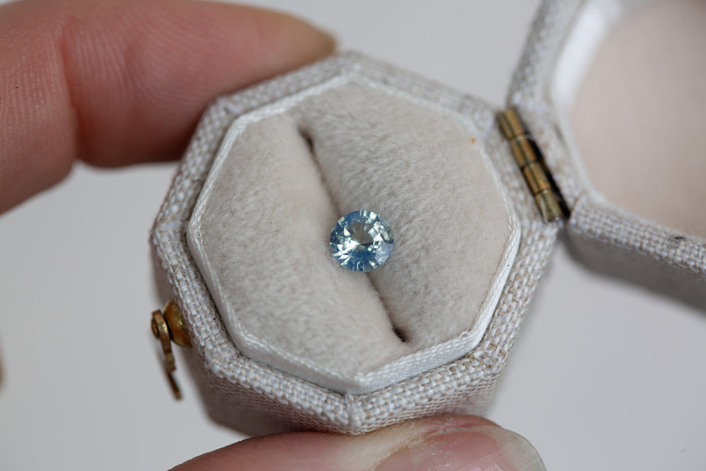 Load image into Gallery viewer, .57ct round opalescent blue sapphire
