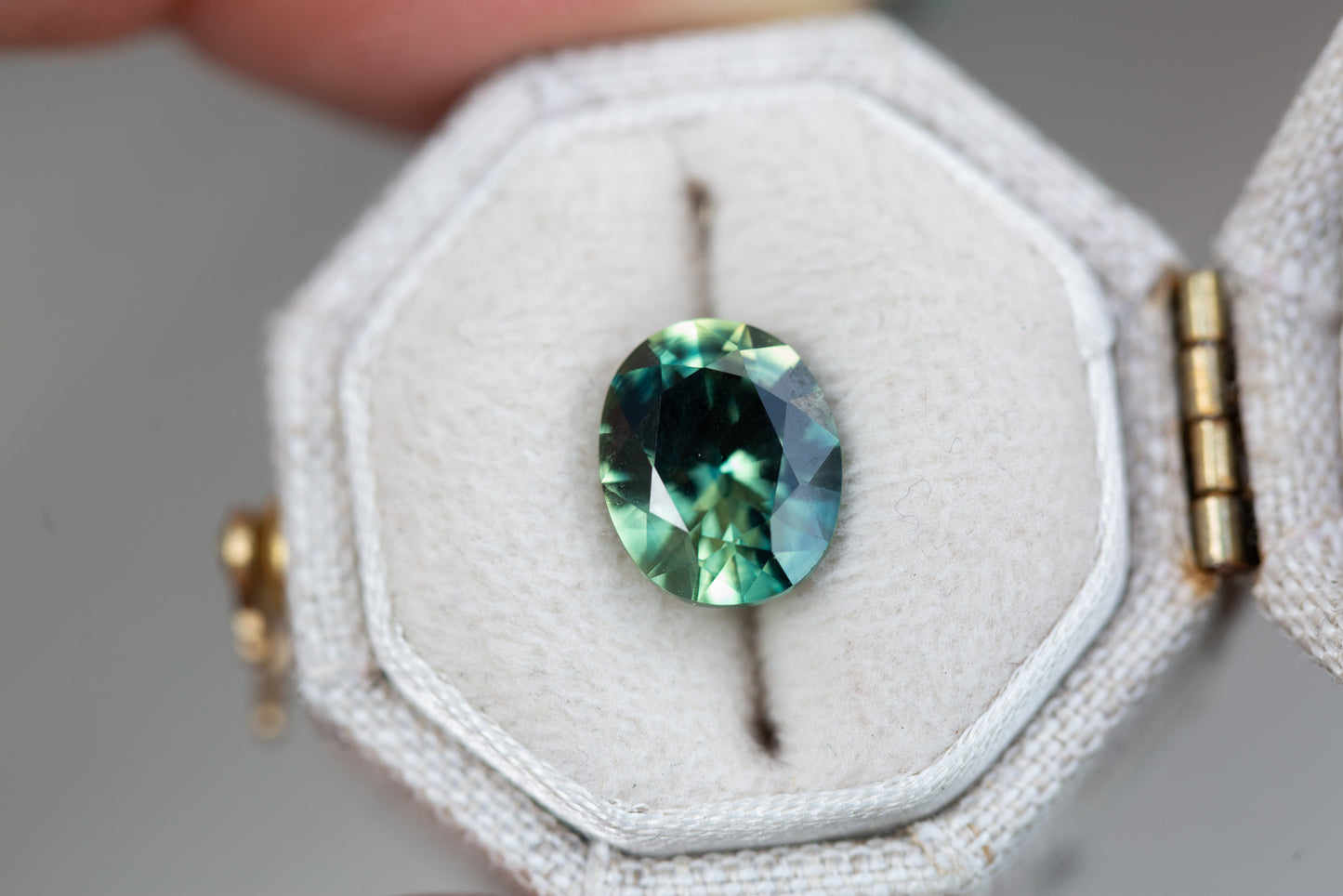 3.05ct oval parti teal green sapphire