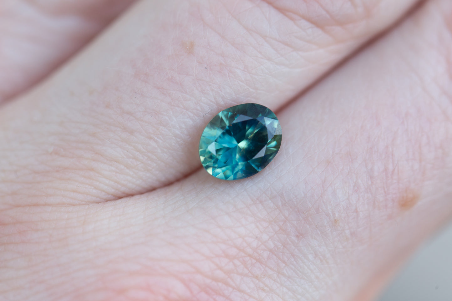 Load image into Gallery viewer, 2.29ct oval deep teal blue sapphire
