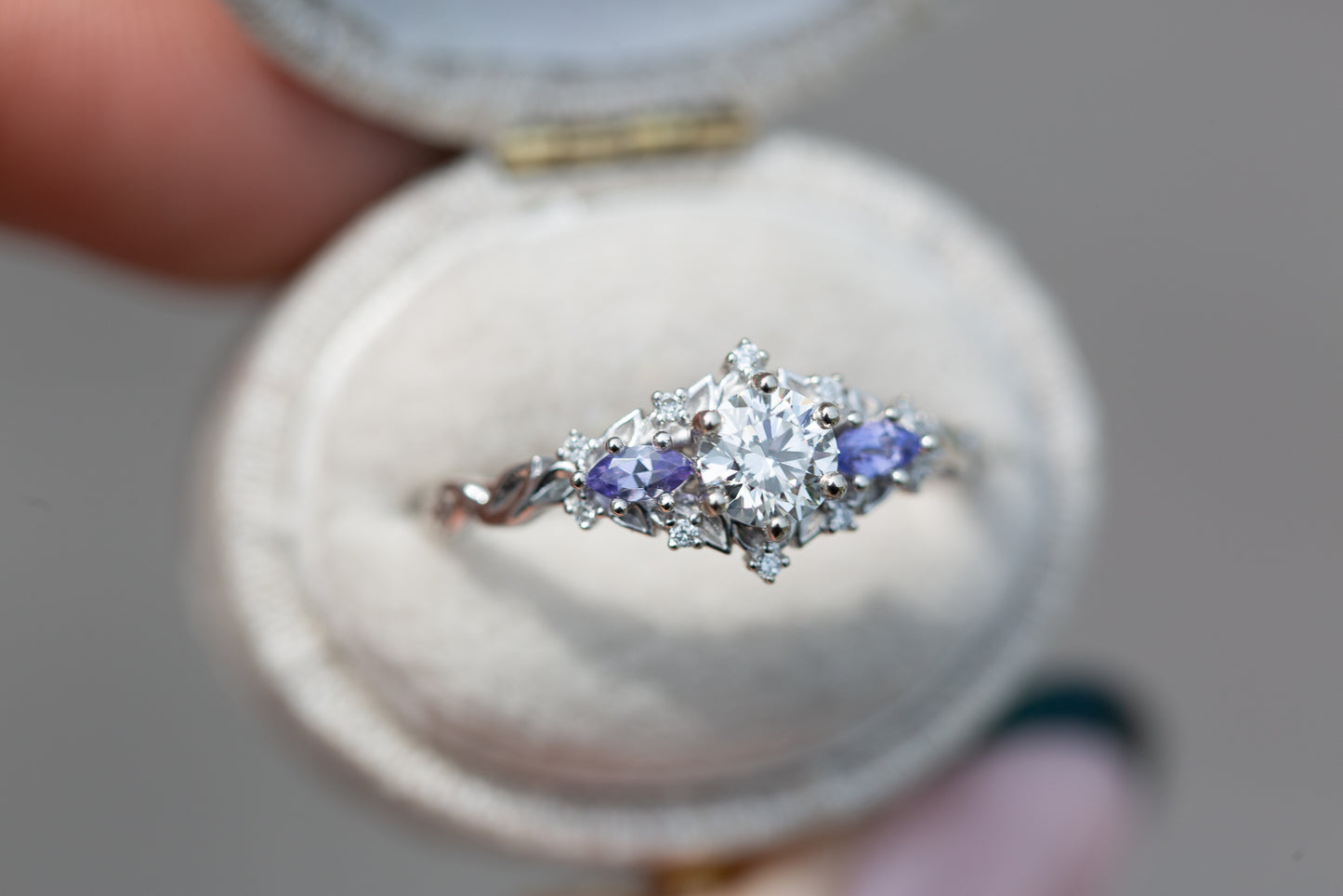 Briar rose three stone with round center and tanzanite sides