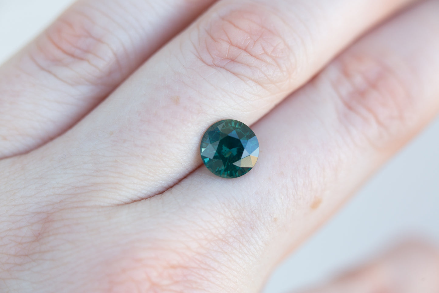 3.24ct round deep green sapphire