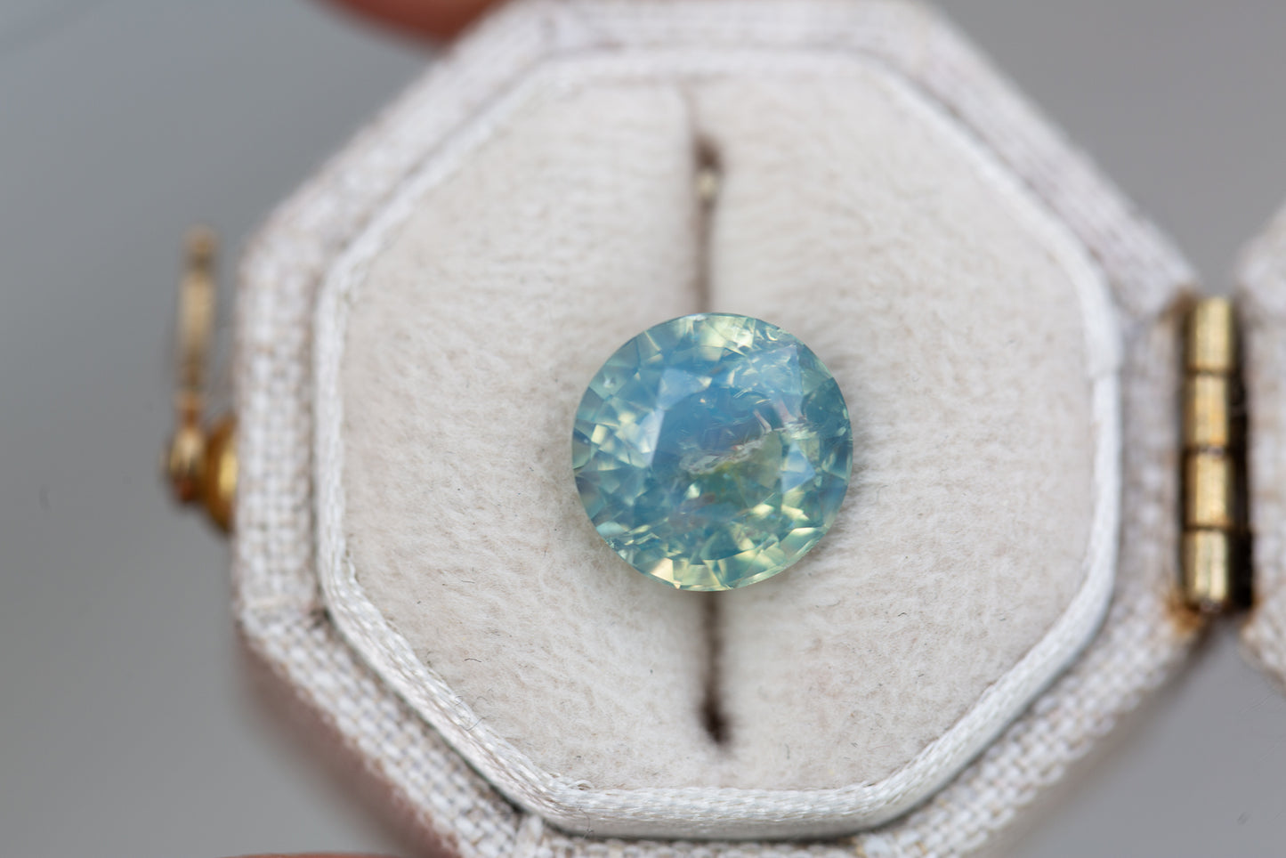 3.86ct round opalescent teal sapphire