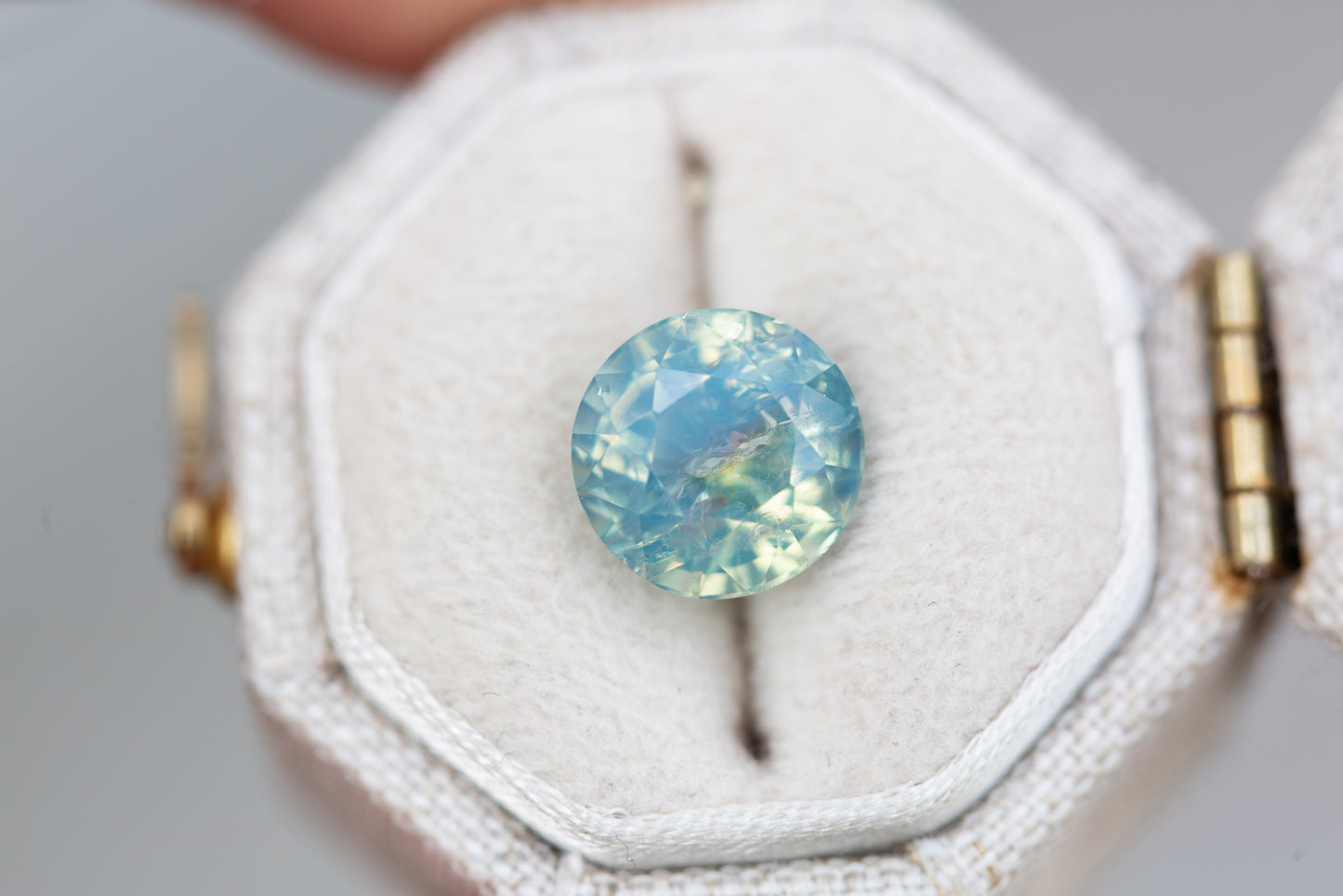 3.86ct round opalescent teal sapphire