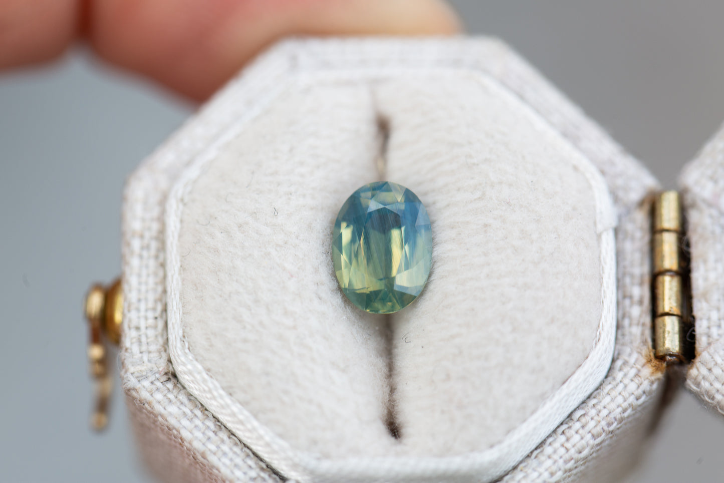 Load image into Gallery viewer, 1.28ct oval opalescent green teal sapphire
