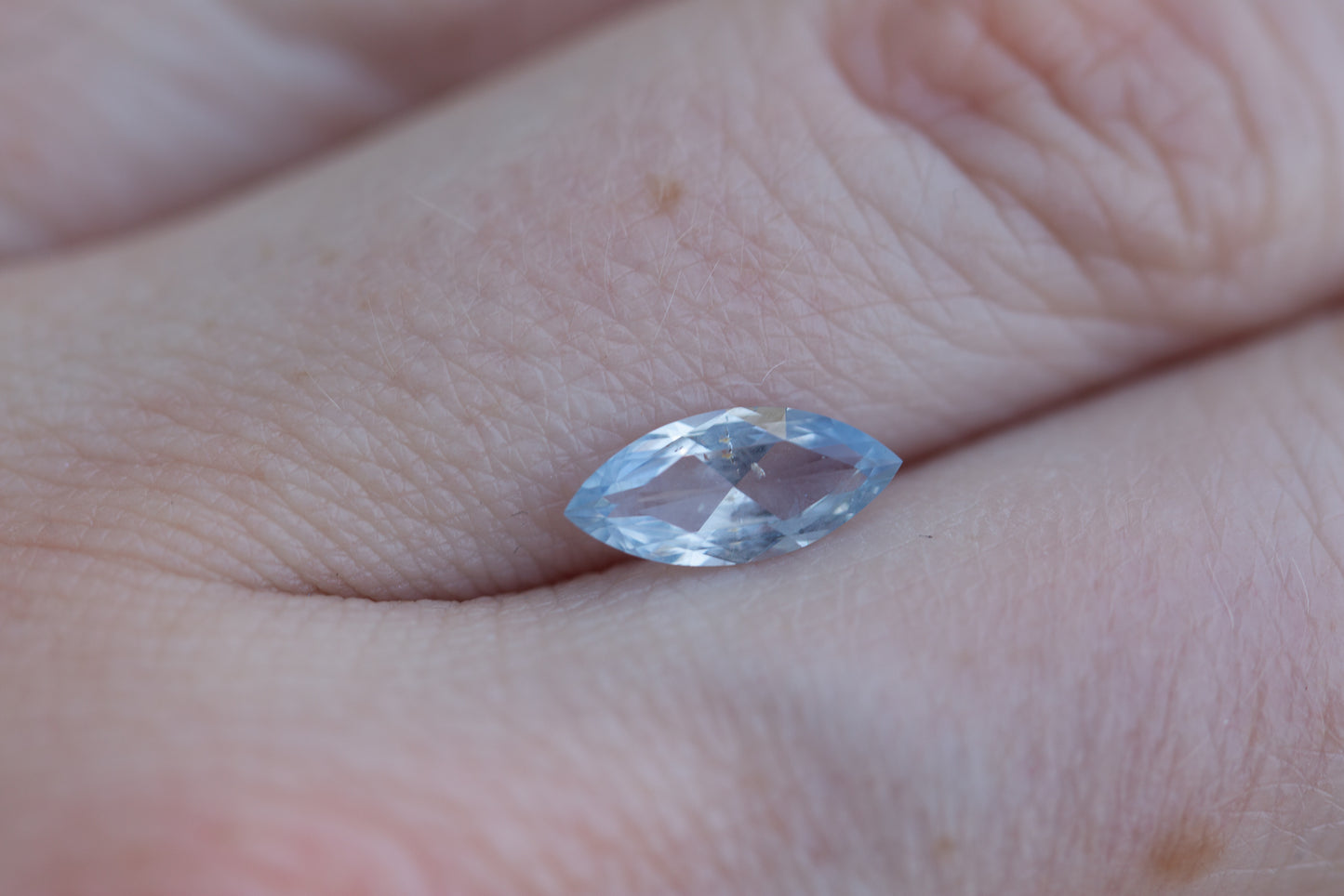 Load image into Gallery viewer, 1ct marquise opalescent lighter blue sapphire
