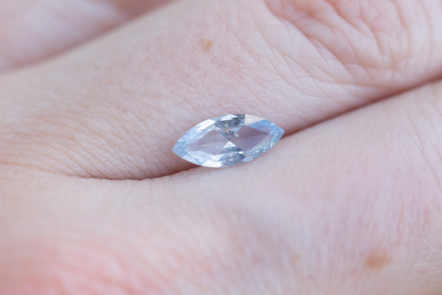 Load image into Gallery viewer, 1ct marquise opalescent lighter blue sapphire
