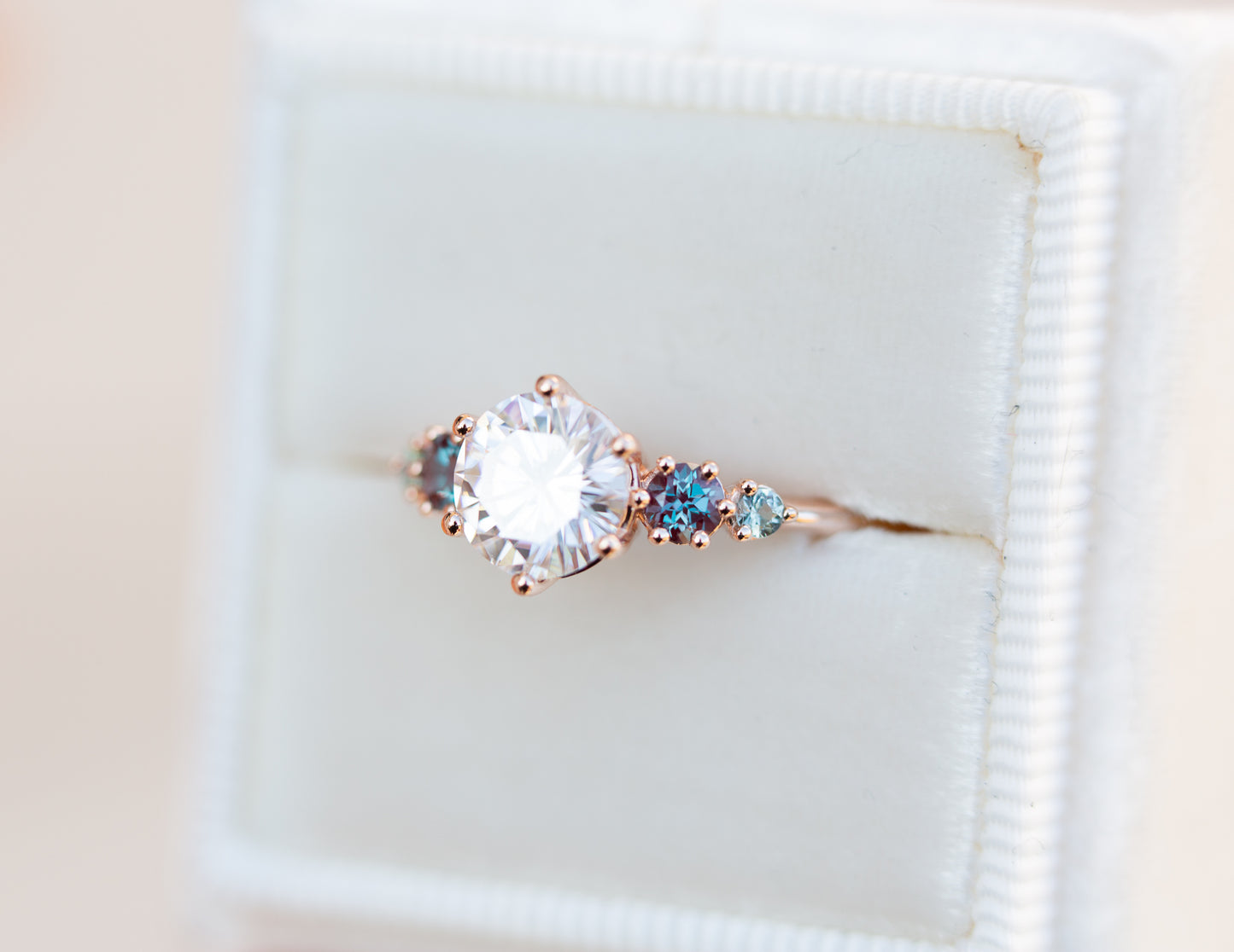 Five stone ring with round moissanite and gemstone side stones