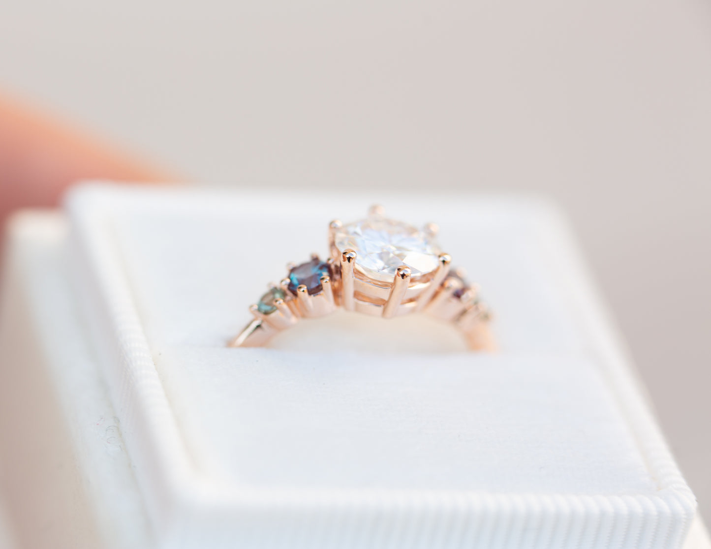 Five stone ring with round moissanite and gemstone side stones