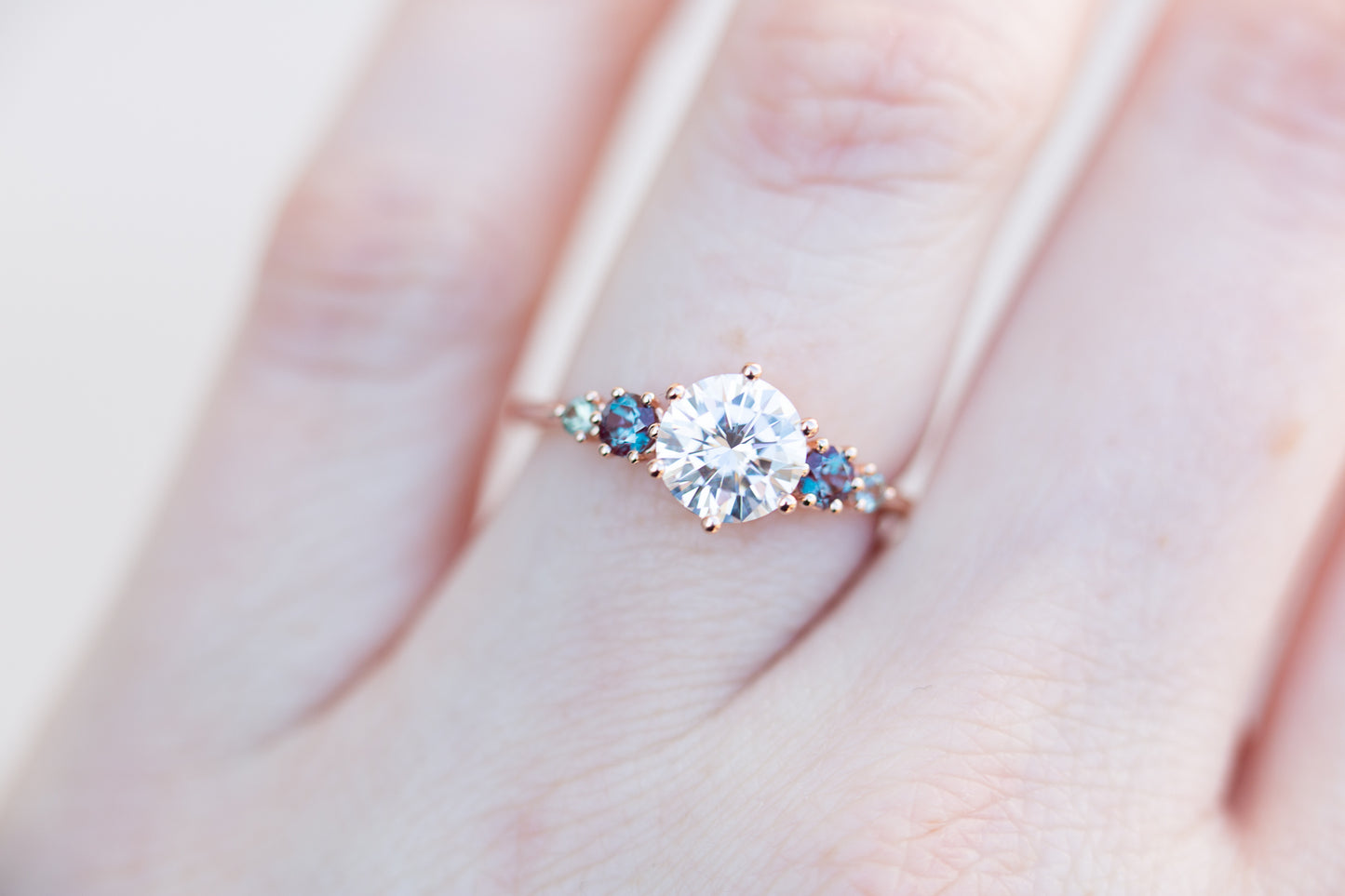 Five stone ring with round moissanite and gemstone side stones