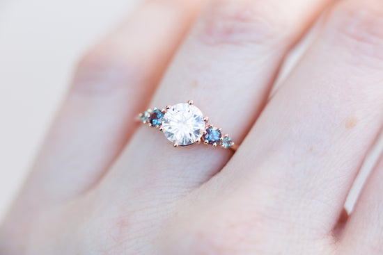Five stone ring with round moissanite and gemstone side stones
