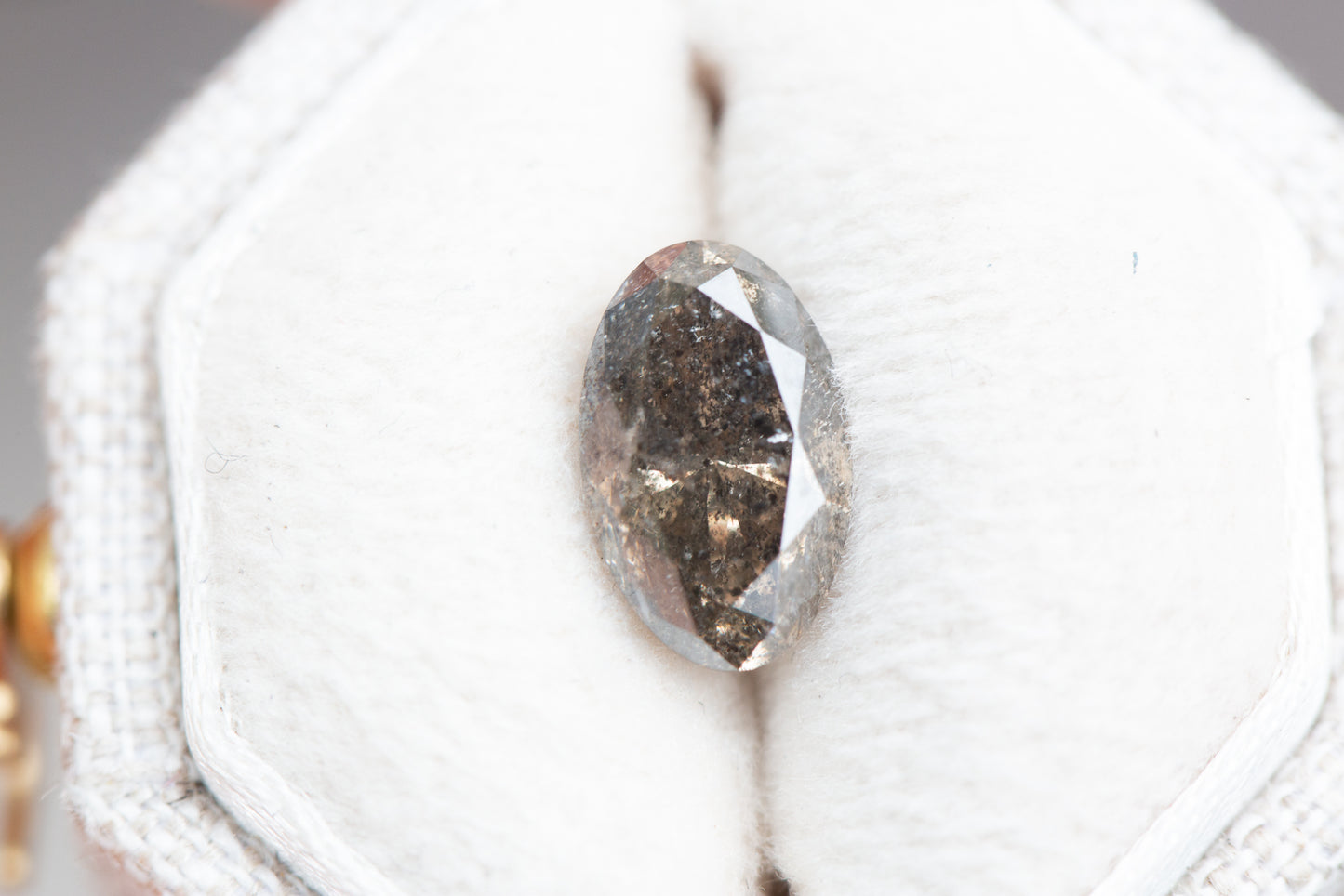 1.56ct oval grey/brown salt and pepper diamond