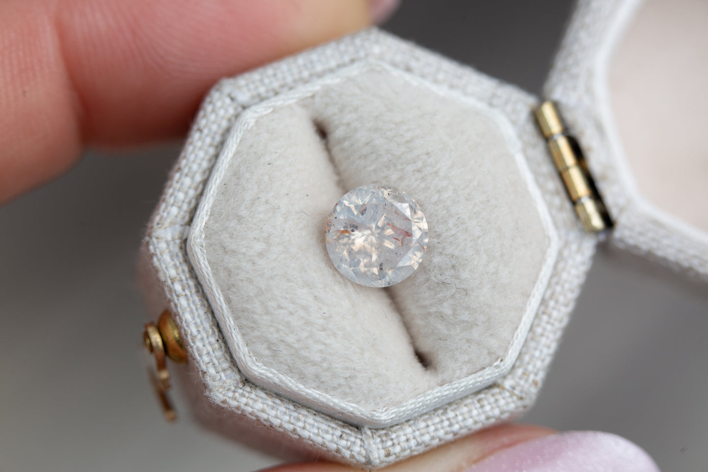 ON HOLD 1.59ct round opalescent white diamond
