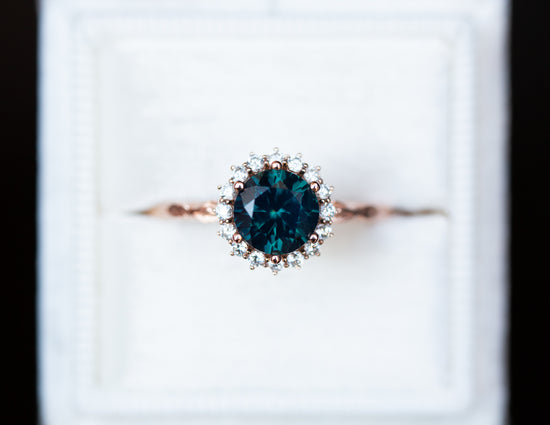 Midsummer setting with blue green sapphire