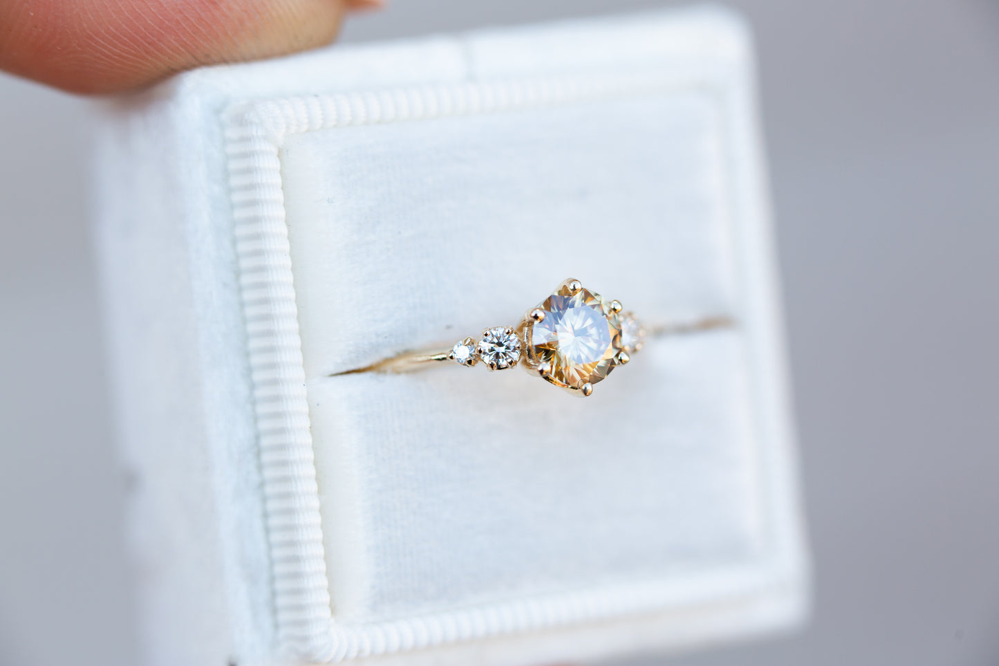 Round champagne moissanite five stone ring