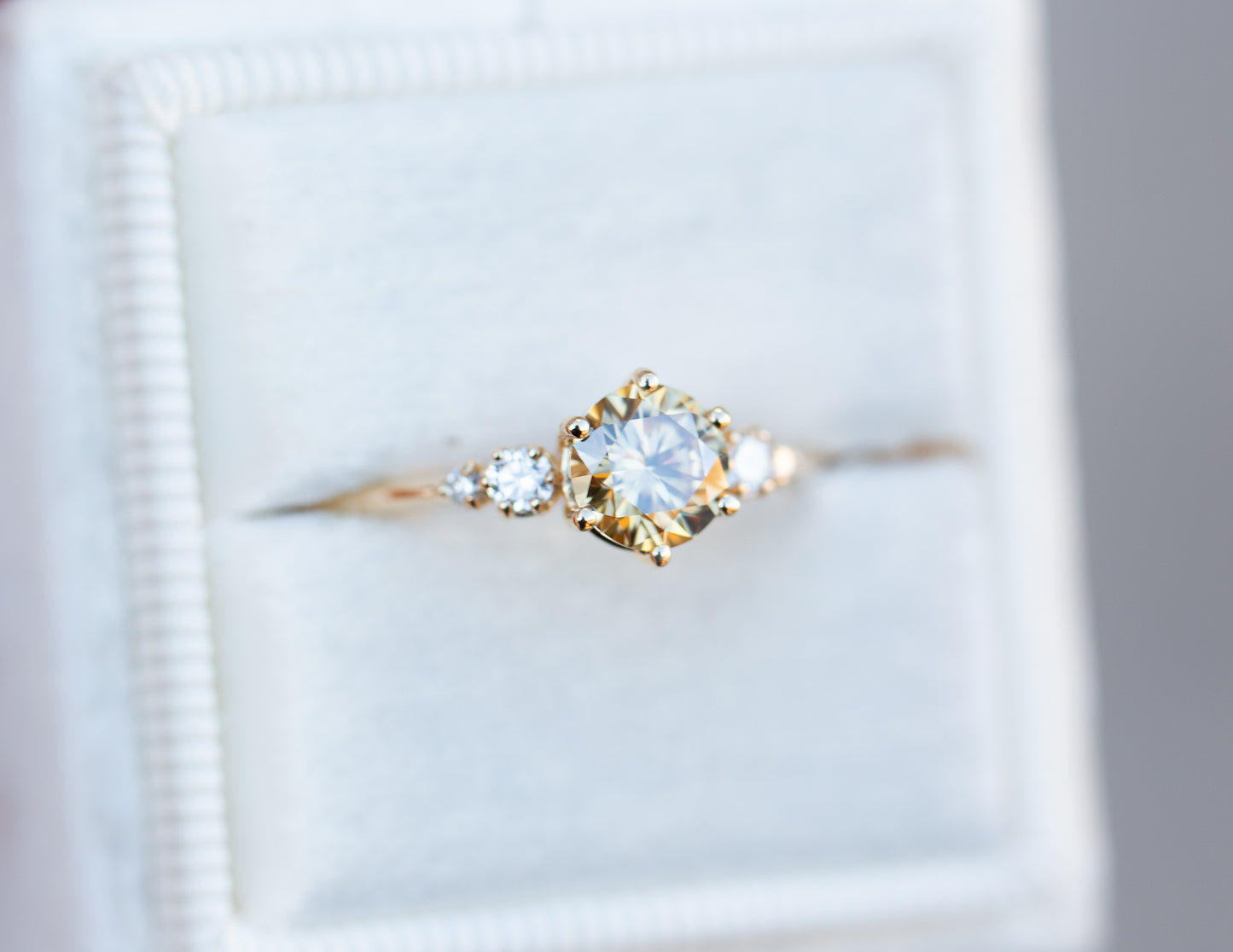 Round champagne moissanite five stone ring