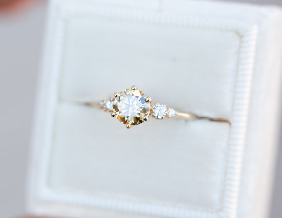 Round champagne moissanite five stone ring