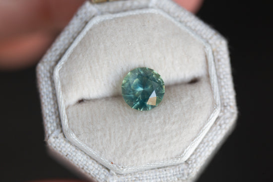1.51ct round rare opalescent teal blue sapphire