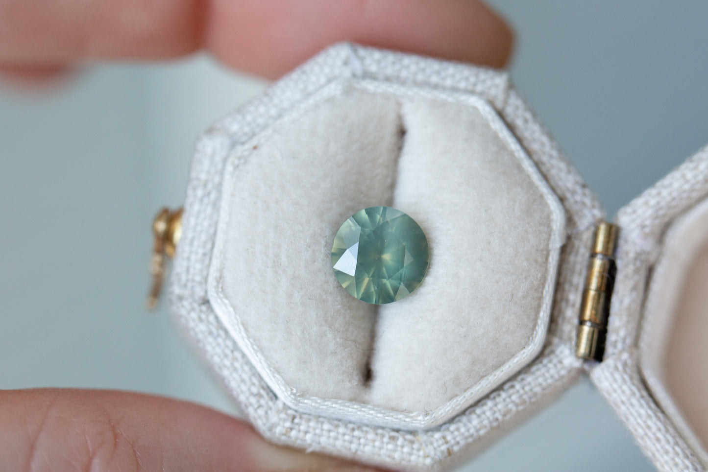 Load image into Gallery viewer, ON HOLD 1.5ct round opalescent light teal sapphire

